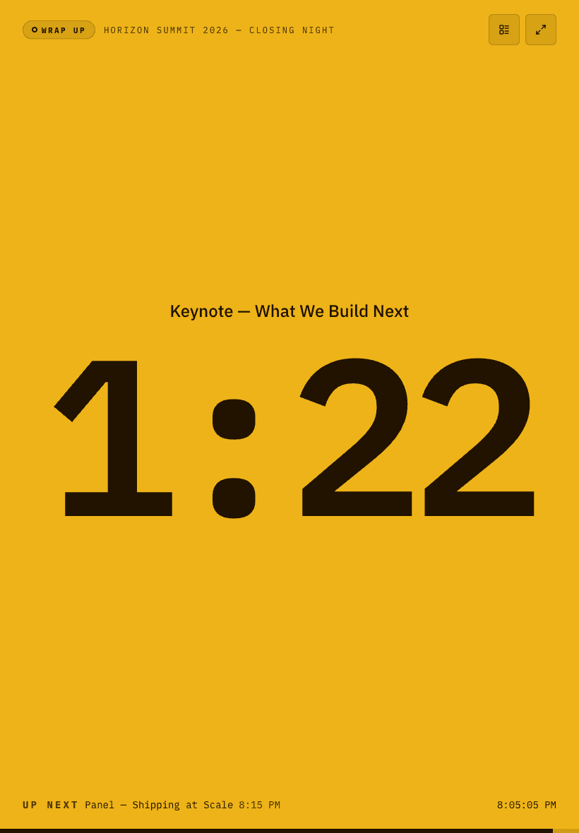 The ROSmaster timer filling a tablet screen, flooded warning amber: a WRAP UP chip in the corner, the cue name 'Keynote — What We Build Next', and 1:22 remaining in figures tall enough to read across a room, with the next item and the wall clock along the bottom edge.